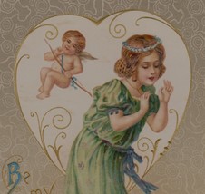 U/S Schmucker Pretty Young Woman in Green W/ Cupid &amp; Valentine Antique Postcard - £26.33 GBP