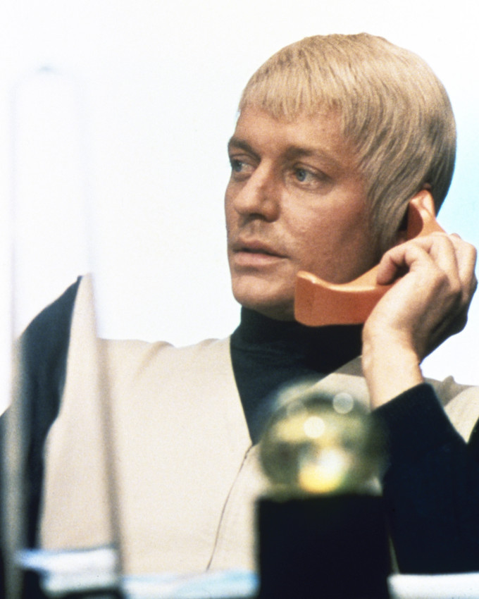 Ed Bishop in UFO as Ed Straker holding futuristic phone seated behind desk 16x20 - $69.99