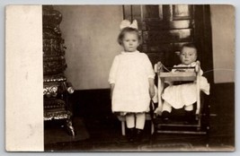 RPPC Darling Children Girl with Boy and Baby in Toy Walker Postcard H23 - £7.03 GBP
