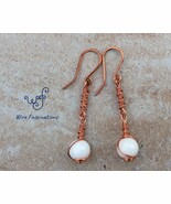 Handmade copper earrings: wire wrapped white tridacna with coil wrapped ... - $522.36 MXN