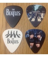 The Beatles 4 x Guitar Pick Set Abbey Road Rock Plectrum New - $16.40 CAD