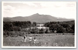 RPPC Mt Chocorua NH Across Lake Darling Girls in Field of  Flowers Postcard J28 - £11.95 GBP