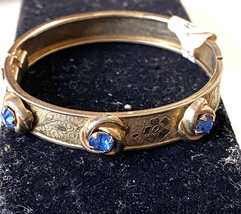 VINTAGE GOLD FILLED SMALL DECORATED BANGLE BRACELET WITH BLUE FAUX GEMS - $49.00