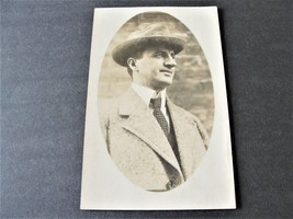 Happy looking Man with Hat - Real Photo Postcard-Stamp Box-AZO (1918-1930).     - £9.34 GBP
