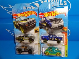 Hot Wheels 2019 Lot 4 Trucks &#39;15 Defender &#39;87 D100 &#39;19 Silverado Tricera-Truck - £7.97 GBP