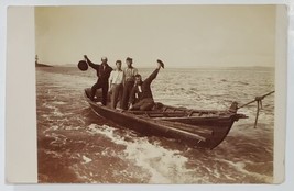 RPPC Four Men in Small Boat being Towed by Rope c1910 Raising Hats Postcard G21 - £27.49 GBP