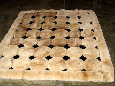 Primary image for Light brown alpaca fur carpet with black rhombus designs, 300 x 280 cm