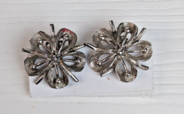 Vintage silver tone floral flower clip on earrings flawed - $12.86