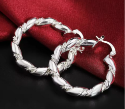 Thick silver braid sterling silver hoops - $313.52 MXN