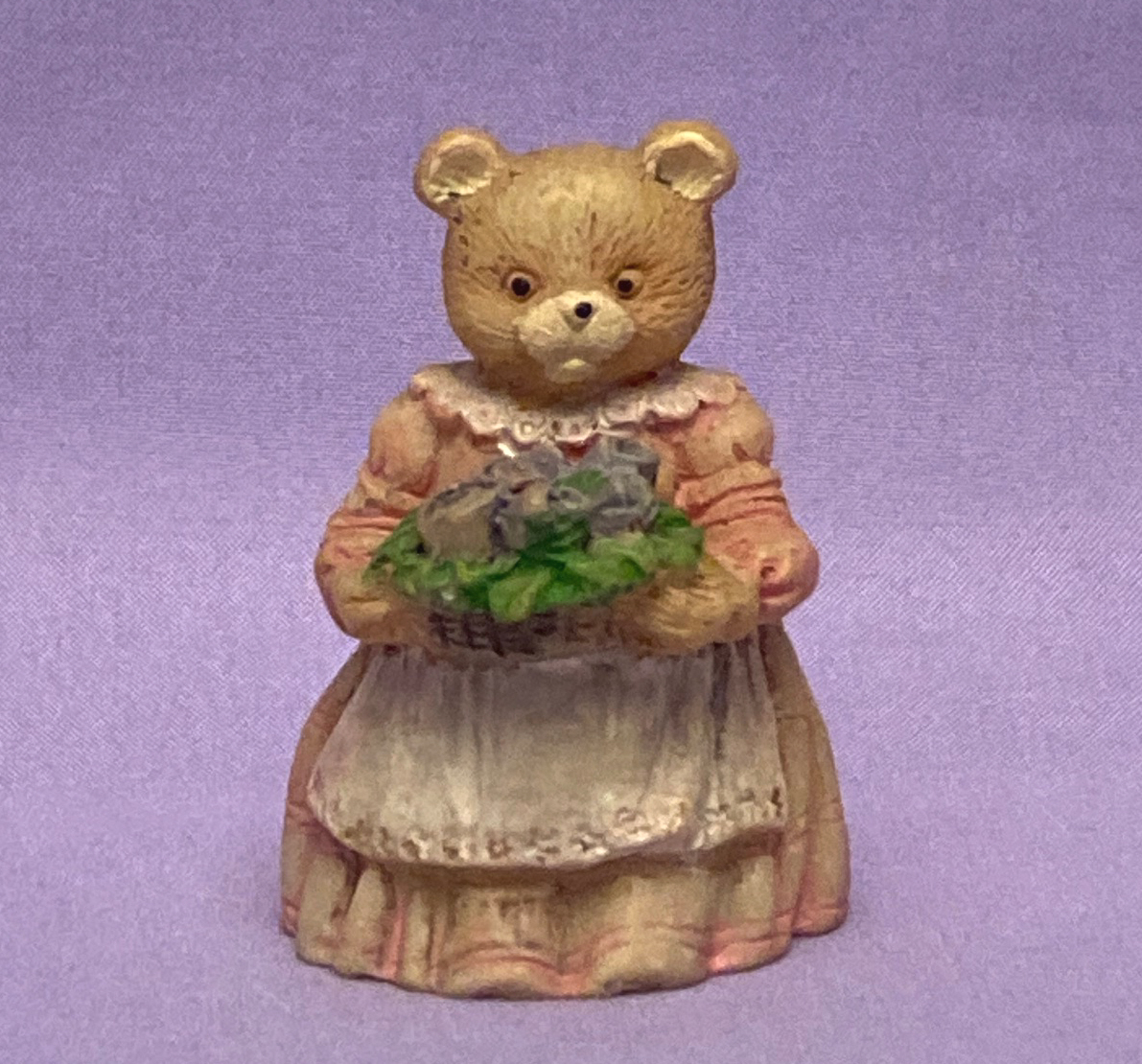 Miniature bear figurine in pink dress with apron and bouquet of purple r... - $3.00