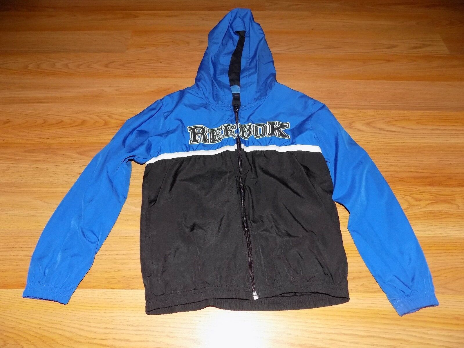 Primary image for Youth Size 7 Reebok Blue Black Zip Front Hooded Lined Windbreaker Jacket GUC