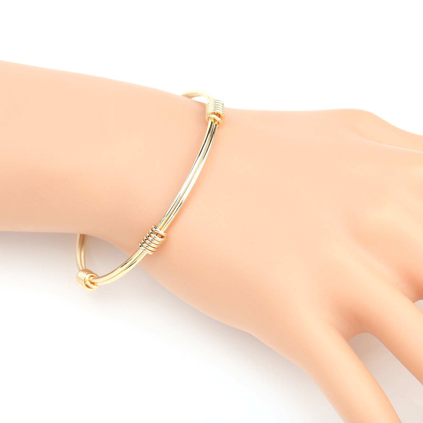 Gold Tone Bangle Bracelet With Contemporary Design