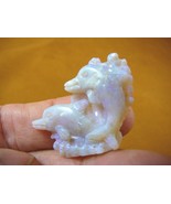 (O-225) little Dolphins in waves White green Coober Pedy Opal carved dol... - $620.56 CAD