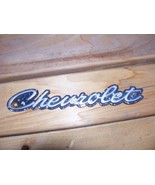 1964 BISCAYNE GRILL EMBLEM CHEVROLET SCRIPT OEM USED CHEVY GM PART - $83.31