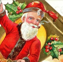 1910 Embossed Christmas Postcard Santa On A Bell Smoking A Pipe - £17.13 GBP