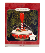 HALLMARK KEEPSAKE MAGIC SANTA'S SPIN TOP CHRISTMAS ORNAMENT 1998 (QLX7573) - $19.99