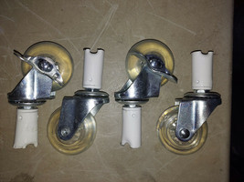 22AA86 SET OF CASTERS, STILL IN LEG CUTOFFS, 2&quot; DIAMETER X 3/4&quot; WIDE WHEELS - $6.73