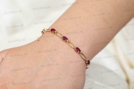 7CT Oval Cut Simulated Red Ruby Tennis Bracelet Gold Plated 925 Silver - £154.88 GBP