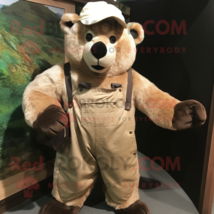 Beige Spectacled Bear mascot costume character dressed with a Dungarees and Hat  - $1,279.00