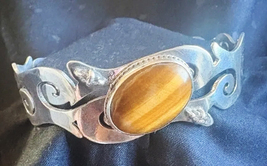 Sterling Silver Cuff Bracelet with Tiger’s Eye and Onyx - $750.00