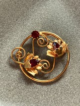 Vintage Open Goldtone Circle w Flowers &amp; Curlicues &amp; Red Rhinestone Accents Pin - £8.88 GBP