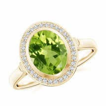 ANGARA Bezel-Set Oval Peridot Ring with Diamond Halo for Women in 14K Solid Gold - £770.21 GBP