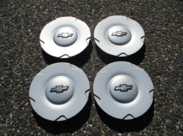 Genuine 2002 to 2006 Trailblazer silver painted hubcaps center caps - $65.06