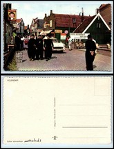 NETHERLANDS Postcard - Volendam, Men In Black Walking In Street, Car, Shops DA - £2.35 GBP
