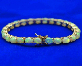 25Ct Oval Cut Lab Created Fire Opal Women&#39;s Tennis Bracelet 14K Yellow Gold Over - £165.45 GBP