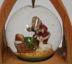 Roman Inc Peace Arch Snow Globe Kneeling Santa 8 Inches Tall image 2
