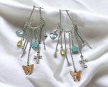 Silver tone long dangle charms earrings 4” - $24.15
