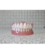 Full upper and lower dentures/false teeth, Brand new. - $135.00