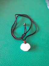 White jade pendant in the shape of a lock - $10.00