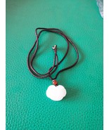 White jade pendant in the shape of a lock - $10.00