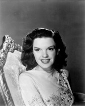 Judy Garland smiling 1940&#39;s studio portrait seated on chair 16x20 inch Poster - £19.65 GBP