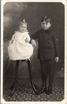 RPPC Baby Girl &amp; Boy with High Leg Chair Patterned Carpet Postcard U2 - £5.49 GBP