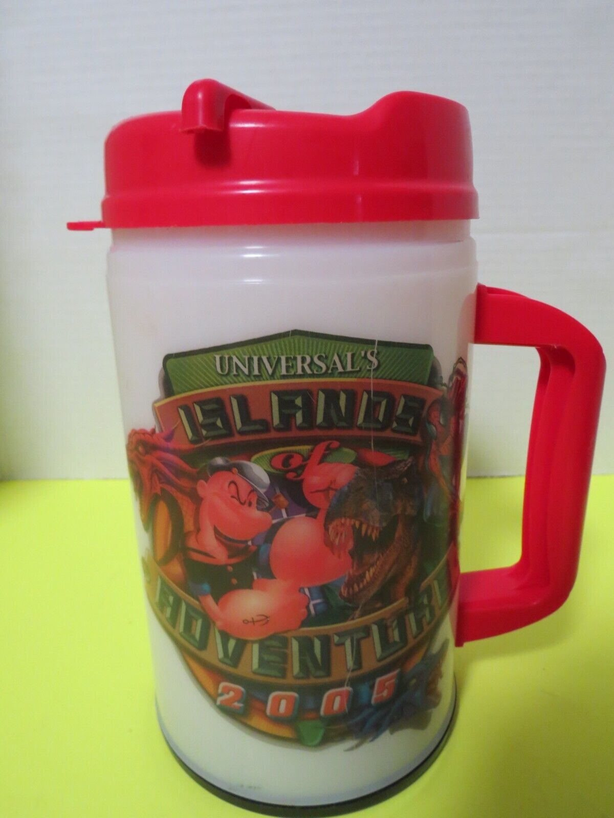 Primary image for Universals Islands Of Adventure Light Up Large Travel Mug W/Lid Plastic 32 Oz