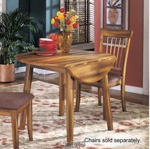 Signature Design By Ashley Berringer Round rustic Leaf Table - $264.09