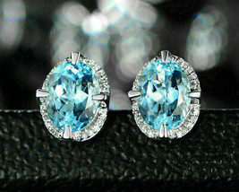 Pendientes de tuerca con halo de diamantes de topacio azul de talla ovalada... - £94.81 GBP