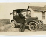 Man Holding Baby by Model T Ford Black and White Photo - $17.80