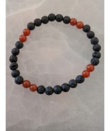 Carnelian and black lava rock 6mm. bead stretch bracelet size 7.5in. - $18.00