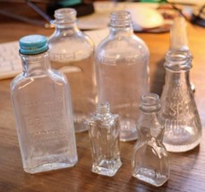 Vintage group of 7 advertising bottles. - $17.50