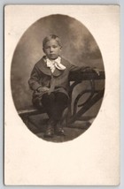 RPPC Cute Little Boy Pin Stripe Outfit Sad Face Eils Bros Pittsburg Postcard E26 - $9.95