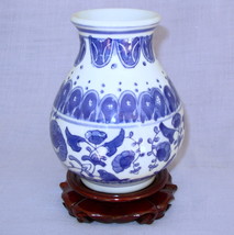 Oriental 6 inch pottery vase wooden base blue floral white - $10.00