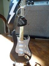 Eric Clapton-Signature Vintage Distressed Black STRAT 1:4Scale Guitar ~-
show... - £24.42 GBP