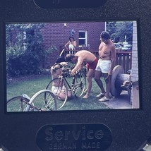 35mm Slide Shirtless Men Fixing Bicycles 1970s - $156.94 MXN
