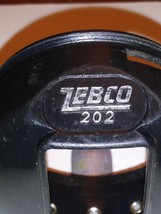  Zebco 202 Reel Part. Rear Cover Assembly - $5.19