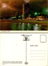 One(1) Hawaii Honolulu Kuhio Beach Lit Up During Nighttime Lights VTG Postcard - £7.51 GBP