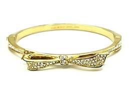 Kate Spade New York Gold Tone Crystal Bow Hinged Bangle Bracelet. - $33.66