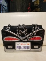 Moschino Jeremy Scott Cadillac Handbag - $46,008.04 MXN